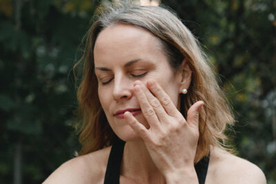 Women applying skin care products.