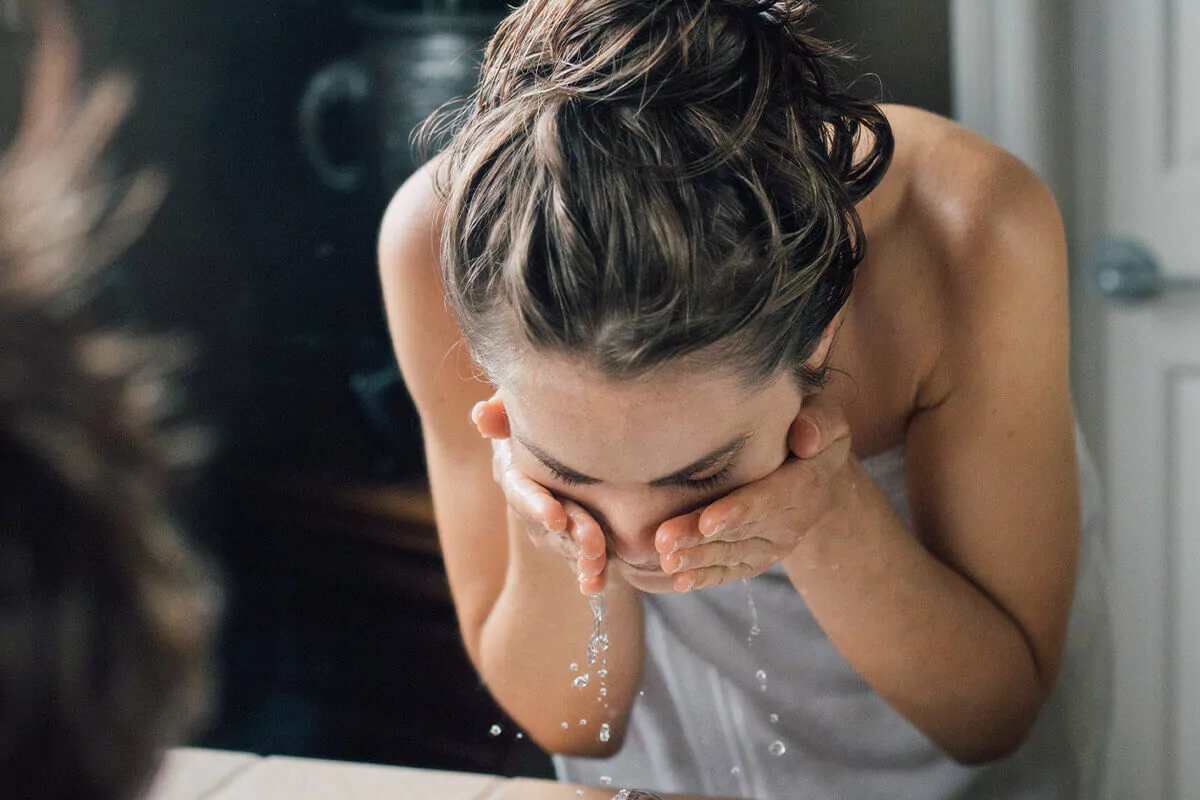 woman washing face